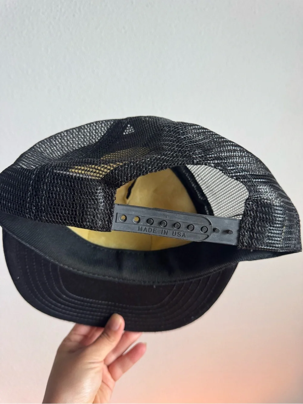Black Trucker Cap with Gold Embroidered NRA Patch